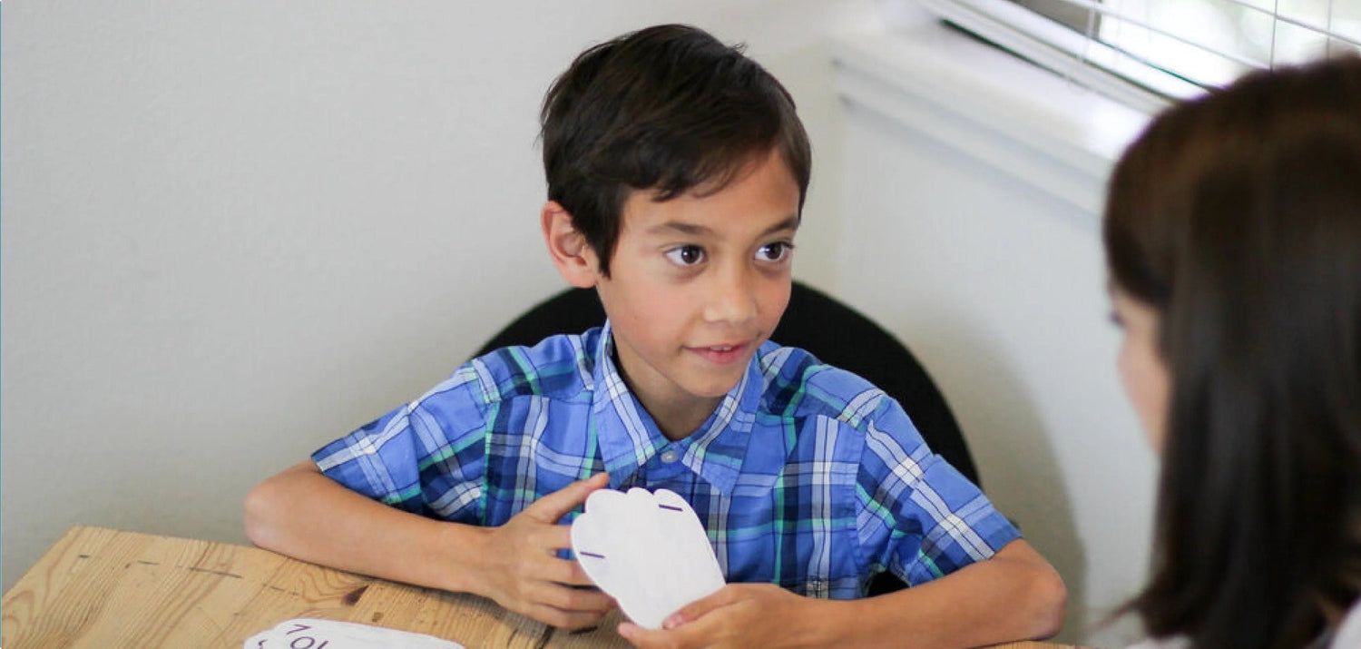 A young boy learning math from an instructor